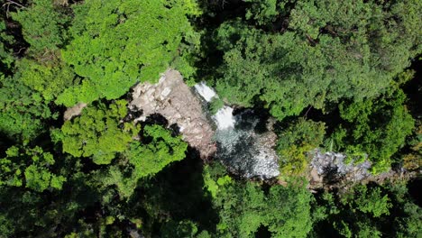 Bird's-Eye-View-Of-Cougal-Cascades-Waterfall-In-Currumbin-Valley,-Queensland,-Australia---Drone-Shot