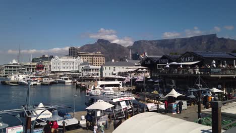 Slow-pan-of-Cape-Town-waterfront,-from-ferris-wheel-to-port
