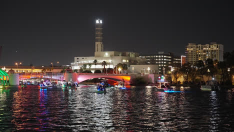 Kennedy-Boulevard-Bridge-And-Boats-On-Parade-Lit-With-Colorful-Lights-At-Night