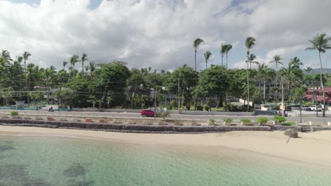 Aerial-Tracking-of-Red-Suv-Car-in-Seaside-Road-of-La-Playa-Town,-Las-Terrenas