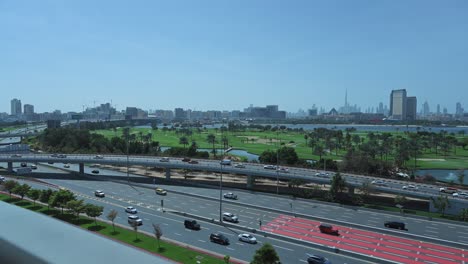 Dubai-skyline-from-Deira-with-traffic-on-Airport-Road,-United-Arab-Emirates