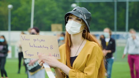 Cute-woman-with-red-hair-clapping-during-a-nonviolent-protest-to-support-black-lives-matter