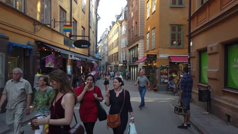 People-move-on-walking-street-on-summer-weekend-in-Stockholm