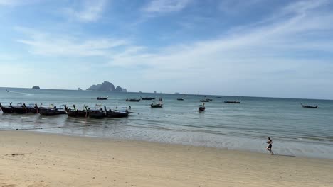 Empty-beach-Krabi-south-of-Thailand,-lonely-person-run-early-morning
