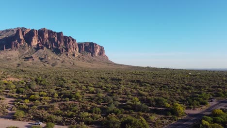 Sport-Utility-Vehicle-driving-on-desert-dirt-road-trailhead-near-Superstition-Mountains-in-Arizona