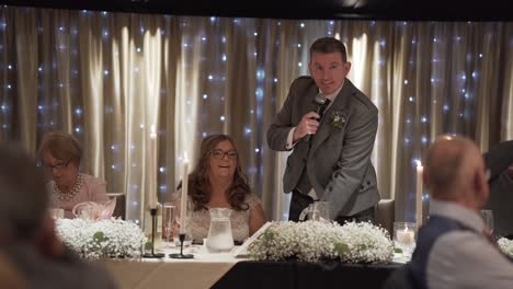 Groom-thanks-all-wedding-guests-on-behalf-of-himself-and-his-new-bride
