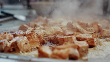 Chicken-teriyaki,-steaming-and-bubbling-as-more-soy-sauce-is-poured-on