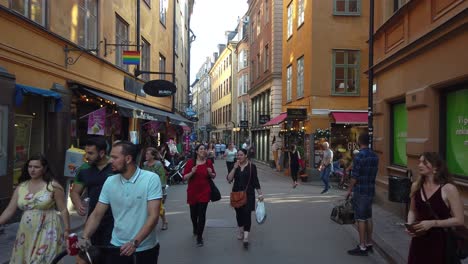 Slomo-shot-of-people-walking-in-Old-Town-in-summer-in-Stockholm,-Sweden