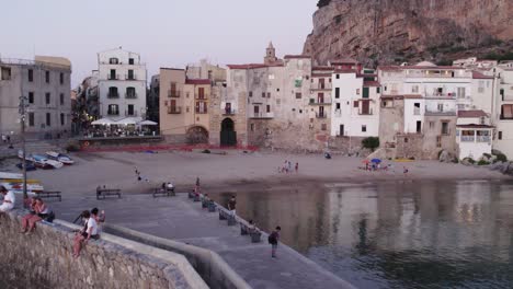 Aerial-view-of-Cefalu-medieval-city-during-summer-at-sunset,-Sicily,-Italy