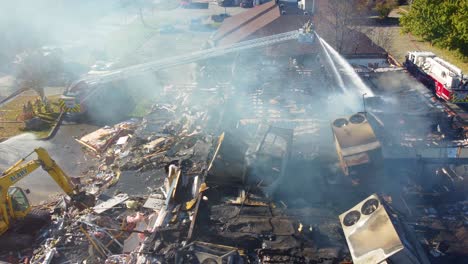 Firefighters-Extinguishing-Fire-On-Ruined-Building-With-Collapsed-Roof-And-Smoke-Rising