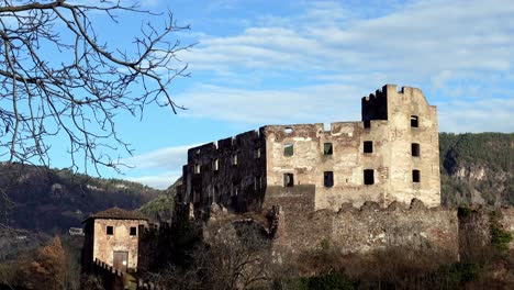 View-of-the-ruins-of-Rafenstein-Castle-located-above-Bolzano,-South-Tyrol,-Italy,-zooming-in