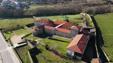 Drone-orbit-around-entrance-of-rectangular-angular-monastery-in-Ourense-Spain