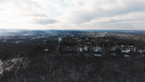 Fayetteville-with-mount-sequoyah,-winter-landscape,-cloudy-sky,-arkansas-usa,-distant-horizon,-aerial-view