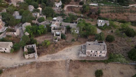 Orbit-View-over-Old-Perithia-Village-Abandoned-Ruins-Houses,-Corfu,-Greece