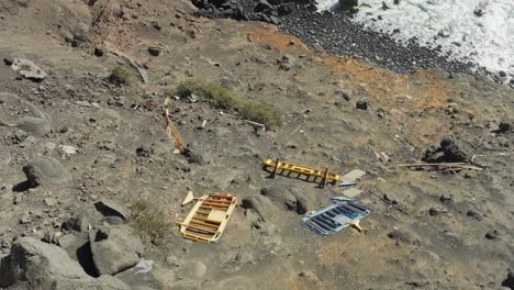 Fallen-guard-rails-on-rocky-cliffside-near-Atlantic-ocean-in-Tenerife