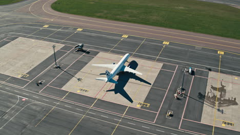 Drone-panning-around-cargo-freighter-Boeing-757-at-Tallinn-airport-on-empty-apron