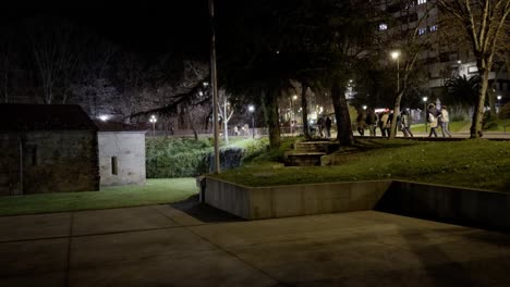 Group-Of-Citizens-Pass-Next-To-Remedios-Chapel,-Ourense,-Galicia,-Spain