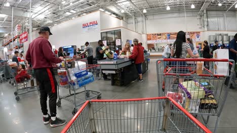 POV---Waiting-in-line-with-other-Costco-customers-to-pay-for-their-purchases