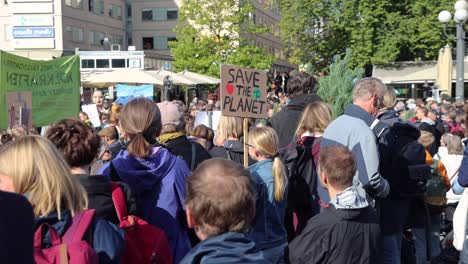 Climate-rally-in-Stockholm,-Sweden,-"Save-the-planet"-sign-visible