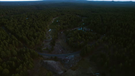 Aerial-View-of-Small-Residential-Community-in-Woods-of-Arizona-USA,-Houses-and-Evergreen-Forest-in-Twilight,-Drone-Shot