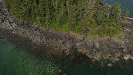 Aerial-Drone-Top-Down-View-Along-Coastal-Rocky-Grey-Bay,-Sandpit,-Moresby-Island,-Canada