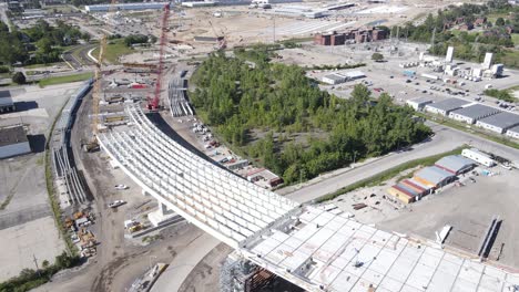 Freeway-leading-up-to-Gordie-Howe-Bridge,-construction-site,-aerial-view