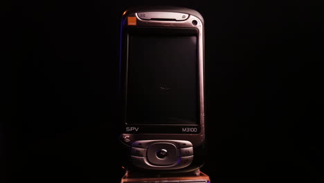 Orange-SPV-M3100-Vintage-Smartphone-From-2000's-Manufactured-by-HTC-for-European-Telecommunication-Company,-Spinning-Close-Up