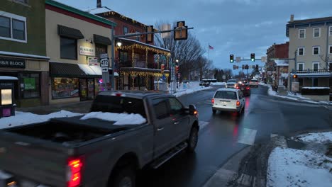 Establishing-low-shot-of-cars-driving-on-a-street-in-an-American-town