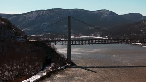 An-aerial-view-of-the-Bear-Mountain-Bridge-on-a-sunny-day-with-clear-blue-skies