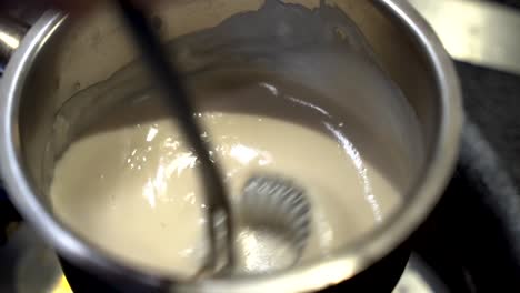 Stirring-a-ball-of-sour-cream-in-slow-motion