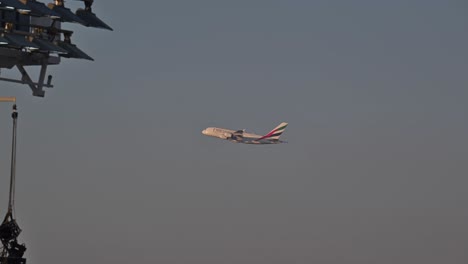 An-Emirates-airline-flight-begins-its-journey-after-taking-off-from-Dubai-International-Airport,-United-Arab-Emirates,-soaring-into-the-skies-on-its-route-to-its-destination