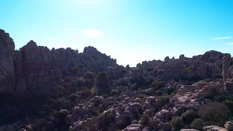 Upward-jib-movement-to-reveal-the-rocky-formation-on-the-nature-reserve-at-El-Torcal-de-Antequera,-Malaga,-Andalusia,-Spain