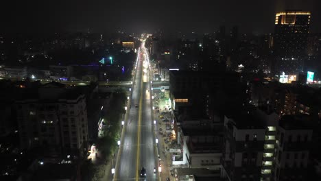 Rajkot-aerial-drone-view-Drone-camera-moving-backwards-Residency-houses-are-visible-all-around-and-lots-of-vehicles-passing-over-the-bridge