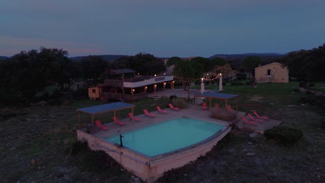 Aerial-view-of-luxurious-garden-with-swimming-pool-and-scenic-landscape-in-southern-France