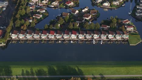 Aerial-view-of-small-harbour-with-houses-during-winter,-Workum,-Netherlands