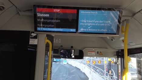 Covid-virus-info-in-English-on-screen-in-bus-in-Stockholm,-Sweden