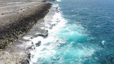 Rugged-coastline-in-shete-boka-national-park,-curacao,-with-waves-crashing,-aerial-view
