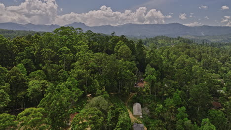 Mirahawatta-Sri-Lanka-Aerial-v2-cinematic-drone-flyover-hillside-residential-capturing-landscape-of-agriculture-farmlands,-jungle-forest-and-mountainous-views---Shot-with-Mavic-3-Cine---April-2023