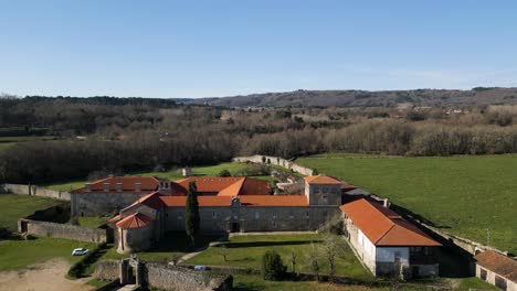 Panoramic-aerial-dolly-to-monastery-of-San-Salvador-de-Ferreira