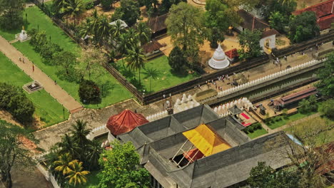 Kandy-Sri-Lanka-Aerial-v13-close-up-birds-eye-view-drone-flyover-prominent-pilgrimage-destination,-historical-site-the-sacred-city,-temple-of-sacred-tooth-relic---Shot-with-Mavic-3-Cine---April-2023