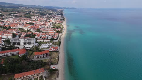 Aerial-drone-view-of-Hanioti-beach-in-Halkidiki,-Greece