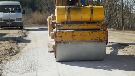Mini-road-roller-compacting-ground-base-soil-for-new-road