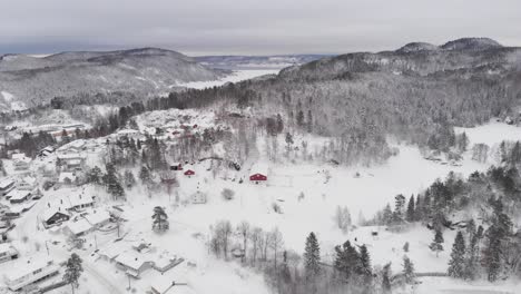 White-Snow-On-House-Roofs-In-Winter