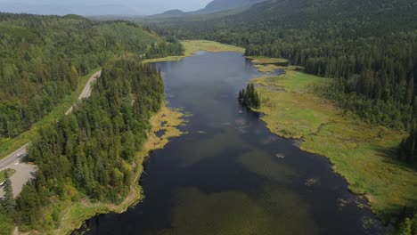 Aerial-Drone-Over-Seeley-Lake-Provincial-Park-with-Alpine-Trees-Covering-the-Beautiful-Landscape-in-Smithers,-Canada
