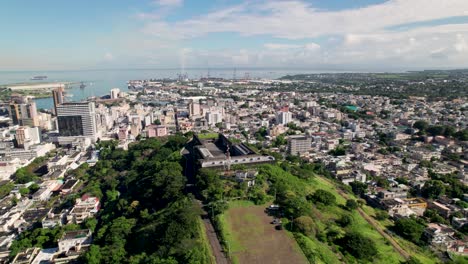 Citadel-fort-adelaide-overlooking-port-louis-in-mauritius,-sunny-day,-aerial-view