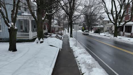 Slow-flight-over-cleared-walkway-in-winter-snow
