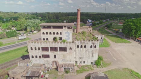 Revealing-Shot-of-Abandoned-Factory-with-Number-Three-in-Cañuelas,-Argentina