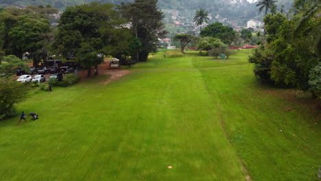 Drone-flying-low-over-the-Le-Golf-Club-de-Yaoundé,-in-cloudy-Cameroon,-Africa