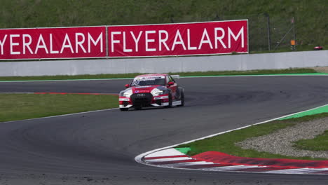 Race-car-going-through-chicane-curves-with-high-speed,-slow-motion