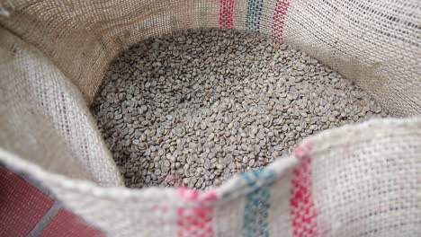 Unroasted-coffee-beans-in-a-large-storage-sack